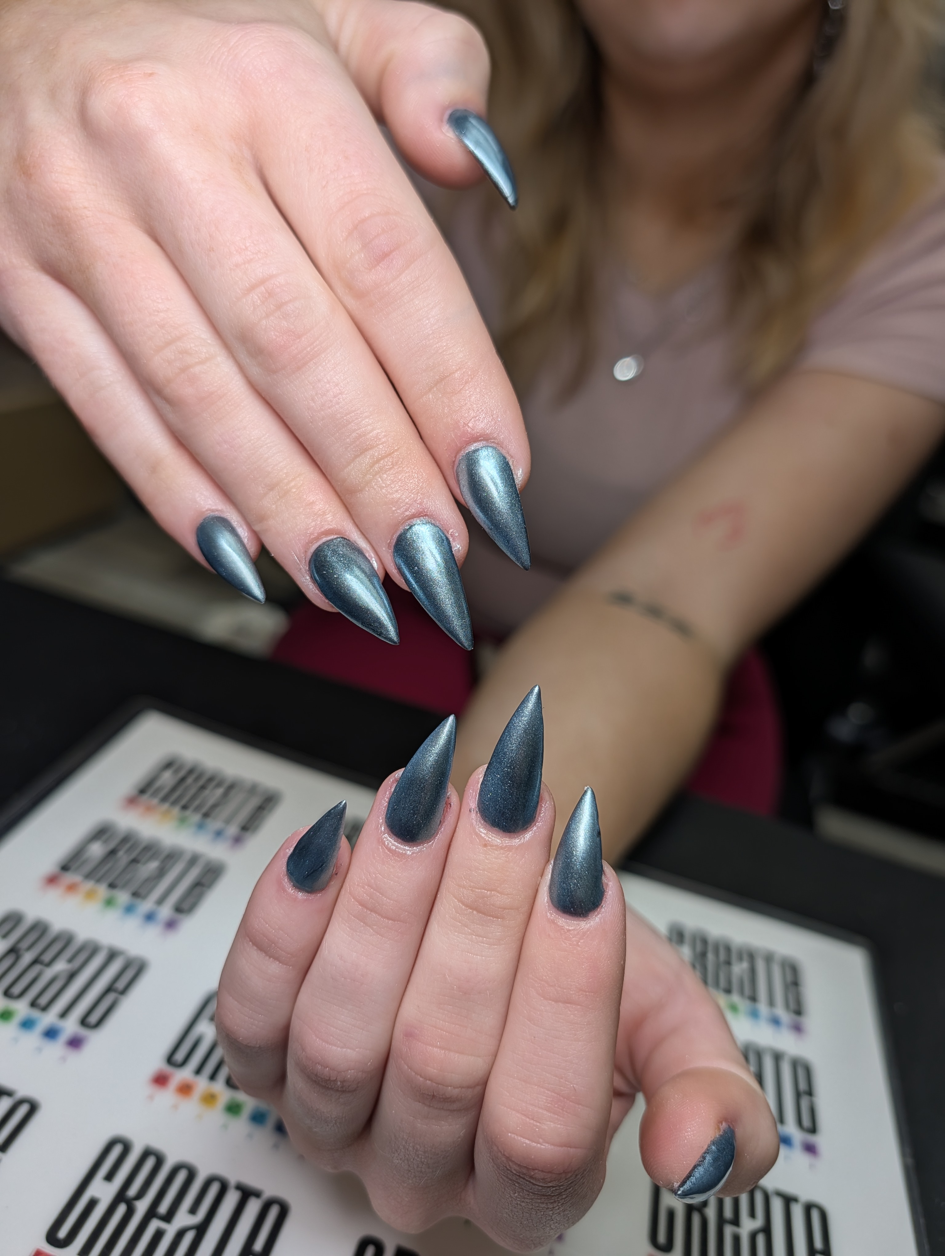 Sculptured set of stilettos with chrome finish.